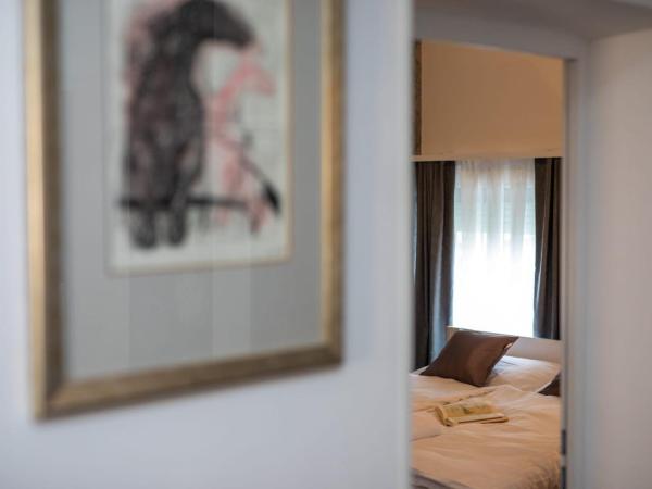 Four Roses : photo 1 de la chambre chambre double supérieure avec deux lits doubles