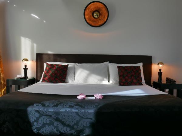 Aram Yamí Boutique Hotel : photo 3 de la chambre chambre de luxe avec terrasse et vue sur la baie