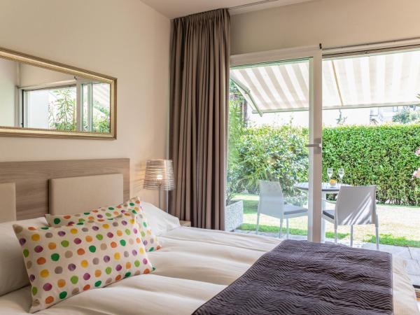 Smart-HOTEL MINUSIO, a Benvenuti Hotel : photo 2 de la chambre chambre double avec jardin