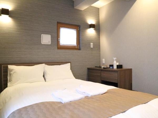 C＆Jホテル : photo 8 de la chambre chambre lits jumeaux