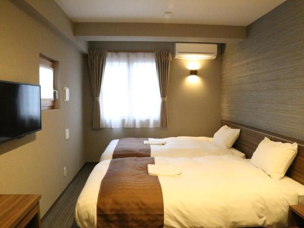 C＆Jホテル : photo 9 de la chambre chambre lits jumeaux deluxe