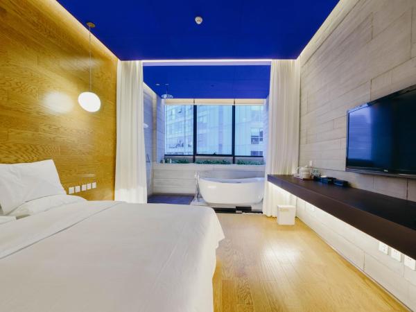 7Shang : photo 1 de la chambre chambre supérieure lit queen-size