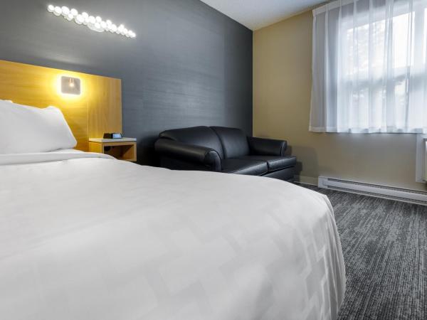 Clarion Pointe Quebec Airport : photo 5 de la chambre chambre lit king-size standard - non-fumeurs