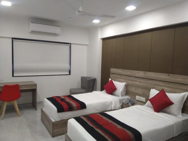 HOTEL INDUS INN : photo 3 de la chambre chambre deluxe double ou lits jumeaux