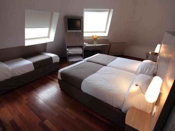 Grand Hotel du Loiret : photo 1 de la chambre chambre triple