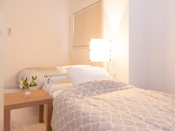 Casa Blanca Guesthouse : photo 3 de la chambre chambre lits jumeaux avec salle de bains commune