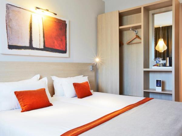 Kyriad Prestige Vannes Centre-Palais des Arts : photo 2 de la chambre chambre lits jumeaux