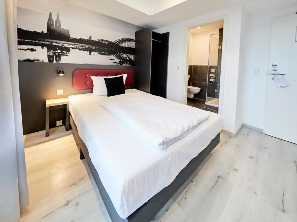SMARTY Cologne Dom Hotel - Boardinghouse - KONTAKTLOSER SELF CHECK-IN : photo 6 de la chambre chambre simple