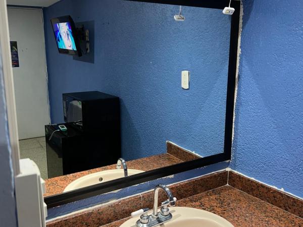 Hotel magallanes con cocineta 100 Metros de playa : photo 6 de la chambre chambre double