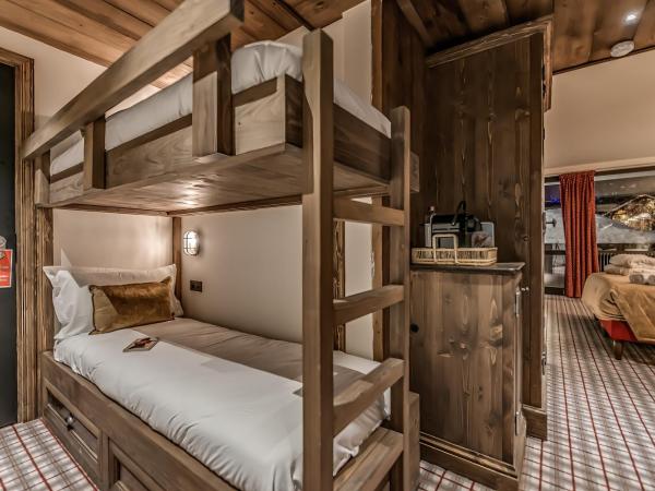 HOTEL LE VAL D'ISERE : photo 4 de la chambre chambre quadruple standard avec lits superposs
