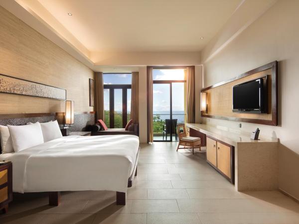 Wanda Realm Resort Sanya Haitang Bay : photo 3 de la chambre chambre lit king-size avec vue frontale sur l'océan