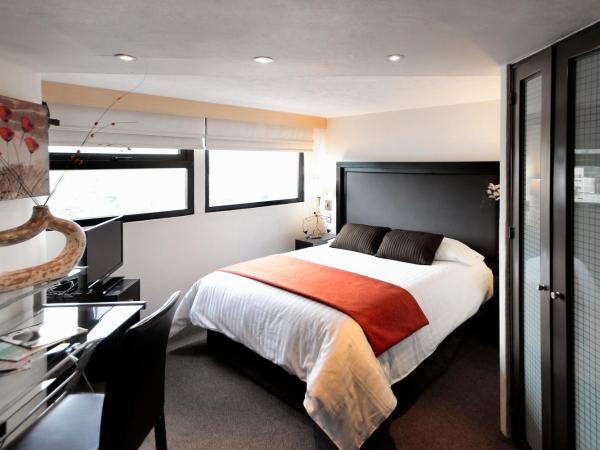 Aztic Hotel and Executive Suites : photo 2 de la chambre chambre exécutive lit queen-size