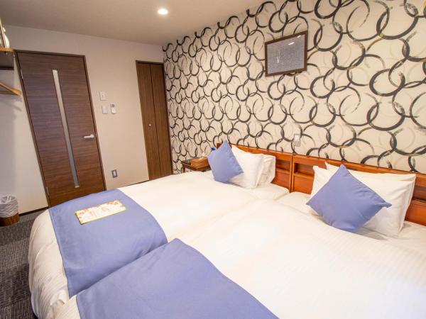 Stay SAKURA Kyoto Shijo Karasuma : photo 4 de la chambre chambre lits jumeaux - vue sur ville