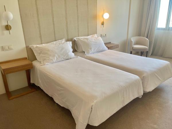 Hotel Oriente : photo 5 de la chambre hébergement lits jumeaux urbain