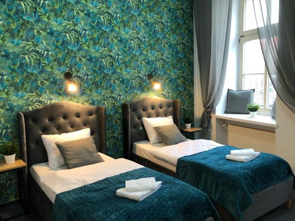 Great Polonia Wrocław Tumski : photo 1 de la chambre chambre lits jumeaux standard