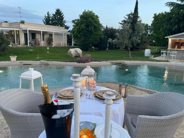 B&B La Magia dei Sogni Relais : photo 4 de la chambre chambre double supérieure avec lit d'appoint - vue sur jardin