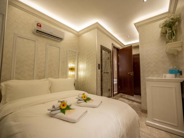 A Residence @ Between Hilton & Cititel Hotel : photo 1 de la chambre chambre double standard