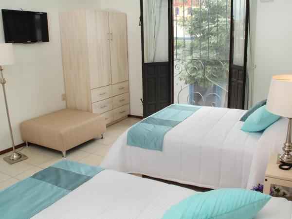 Hotel La Casa de María : photo 4 de la chambre chambre double avec 2 lits doubles