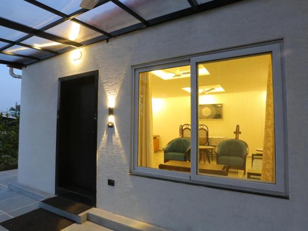 Family Vacay In Green Settings : photo 10 de la chambre appartement - vue sur jardin