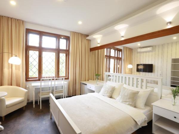 Wellness Pension Ametyst : photo 1 de la chambre chambre double deluxe - vue sur jardin