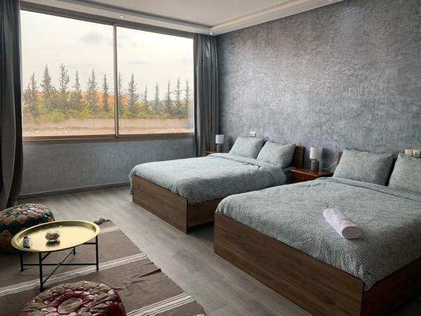 Riad L'Aéroport : photo 1 de la chambre chambre deluxe avec 2 lits queen-size