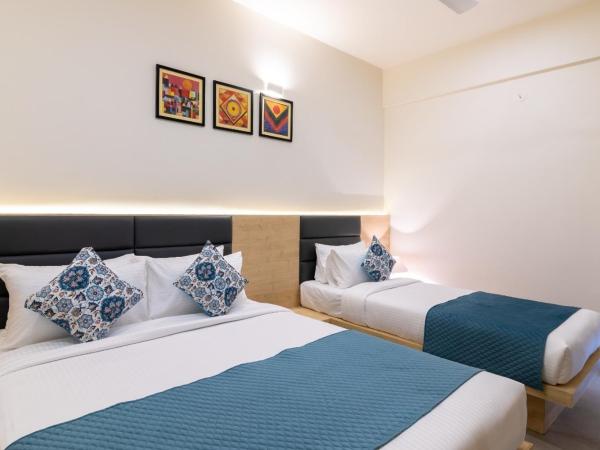 Iris Suites : photo 1 de la chambre chambre triple deluxe