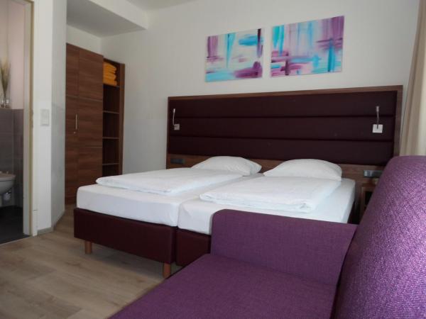 Pension Elisabeth - Rooms & Apartments : photo 2 de la chambre chambre lits jumeaux supérieure