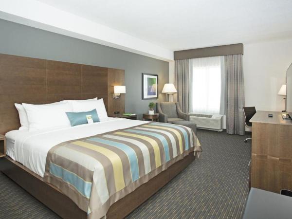 Wingate by Wyndham Calgary Airport : photo 1 de la chambre chambre lit king-size - animaux acceptés - non-fumeurs