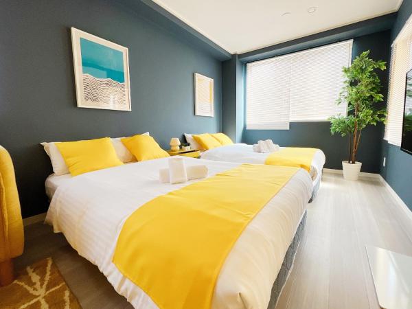 OUCHI HOTEL Nagarekawa with Dogs : photo 1 de la chambre appartement avec balcon