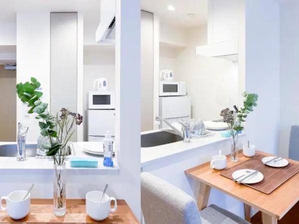 japan house nishishinjuku : photo 2 de la chambre chambre lits jumeaux - vue sur jardin