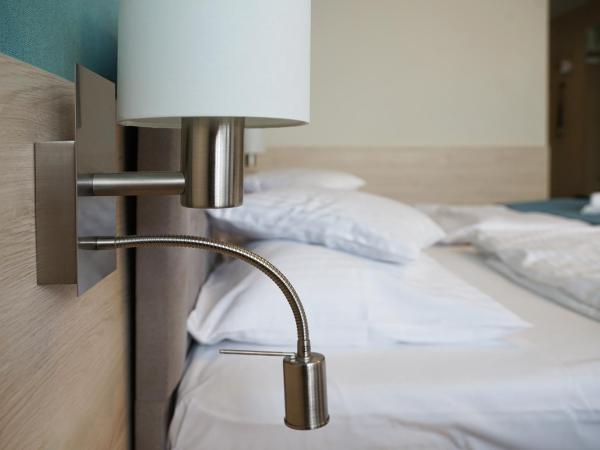 Apartamenty Nad Parsętą Szpitalna 7 : photo 2 de la chambre chambre double ou lits jumeaux