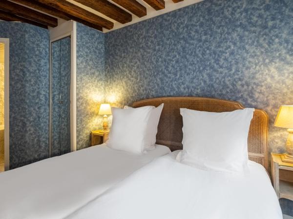 Hôtel Baudelaire Opéra : photo 2 de la chambre chambre lits jumeaux avec baignoire