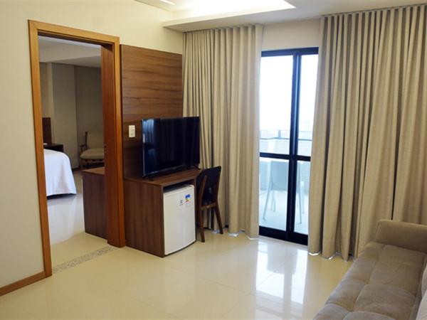 Pituba Praiamar Hotel : photo 5 de la chambre suite lit king-size avec baignoire spa