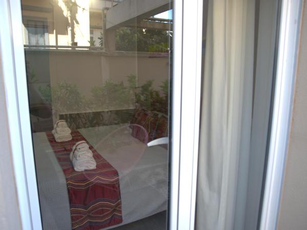 Regina Margherita Suite : photo 4 de la chambre chambre lit king-size - vue sur jardin