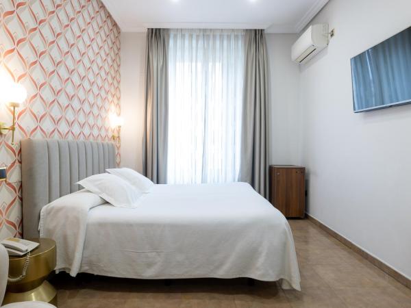 Hostal Oriente : photo 4 de la chambre chambre double ou lits jumeaux - vue sur ville