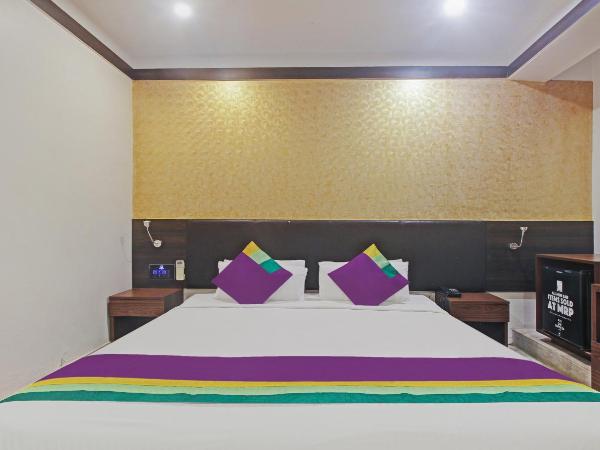 Treebo Premium Dee Empresa : photo 4 de la chambre chambre double deluxe