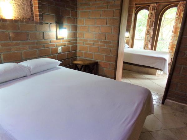 Hotel Casa de Lirio Diamante : photo 1 de la chambre chambre lits jumeaux