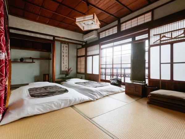 ゲストハウス君彩家 kimidoriya : photo 1 de la chambre chambre triple avec salle de bains commune