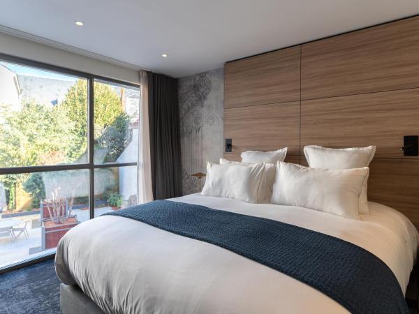 Les Trésorières : photo 2 de la chambre chambre double deluxe (annexe « le cube »)