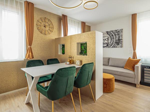 EH Apartments Merkur : photo 5 de la chambre suite deluxe avec lit king-size