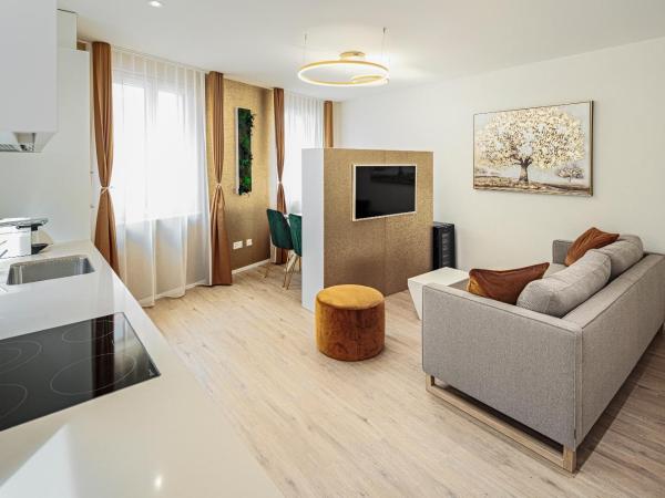 EH Apartments Merkur : photo 3 de la chambre suite supérieure lit king-size