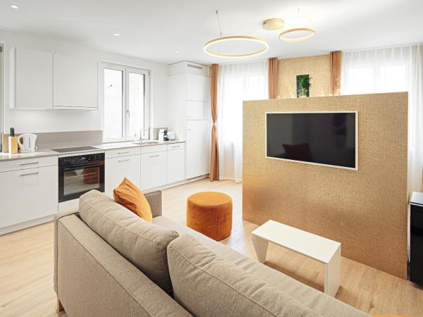 EH Apartments Merkur : photo 2 de la chambre suite supérieure lit king-size