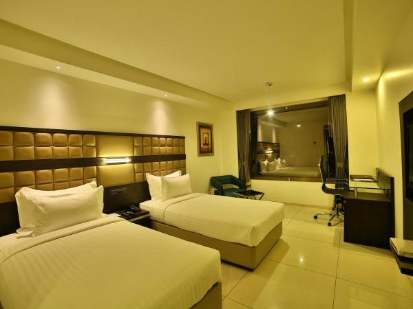 HOTEL G EXPRESS Formerly Known as TGB Express : photo 5 de la chambre deluxe room (locals and unmarried couples are not allowed)