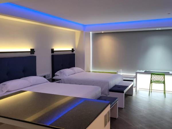 WeEnjoy Hotels Grand Prix Aeropuerto CDMX : photo 9 de la chambre chambre double avec 2 lits doubles