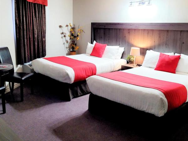 Hotel et Motel Le Chateauguay : photo 2 de la chambre chambre double supérieure avec deux lits doubles