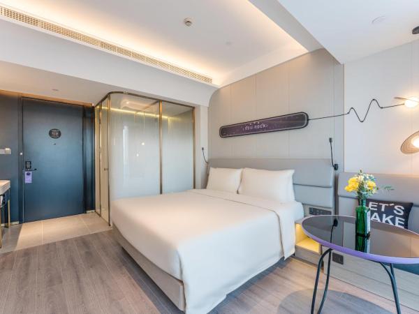 Atour Light Music Hotel Suzhou Panmen Ancient Canal : photo 1 de la chambre chambre double de luxe - vue sur jardin