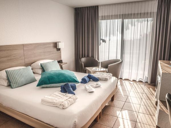 Thalacap Camargue : photo 1 de la chambre chambre double standard - rez-de-chaussée - vue sur jardin (accès gratuit au spa)