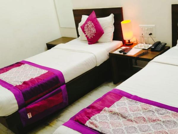 Homestayinn : photo 2 de la chambre chambre lits jumeaux deluxe