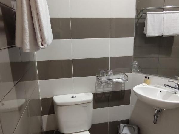 Agogo Downtown Hotel Surabaya : photo 4 de la chambre chambre quadruple