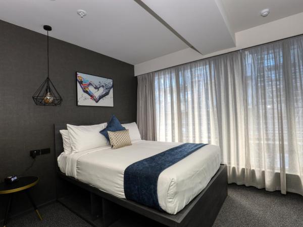 Microtel by Wyndham Wellington : photo 1 de la chambre chambre lit queen-size deluxe 
